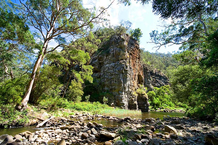 The river flows and tumbles through rock pools