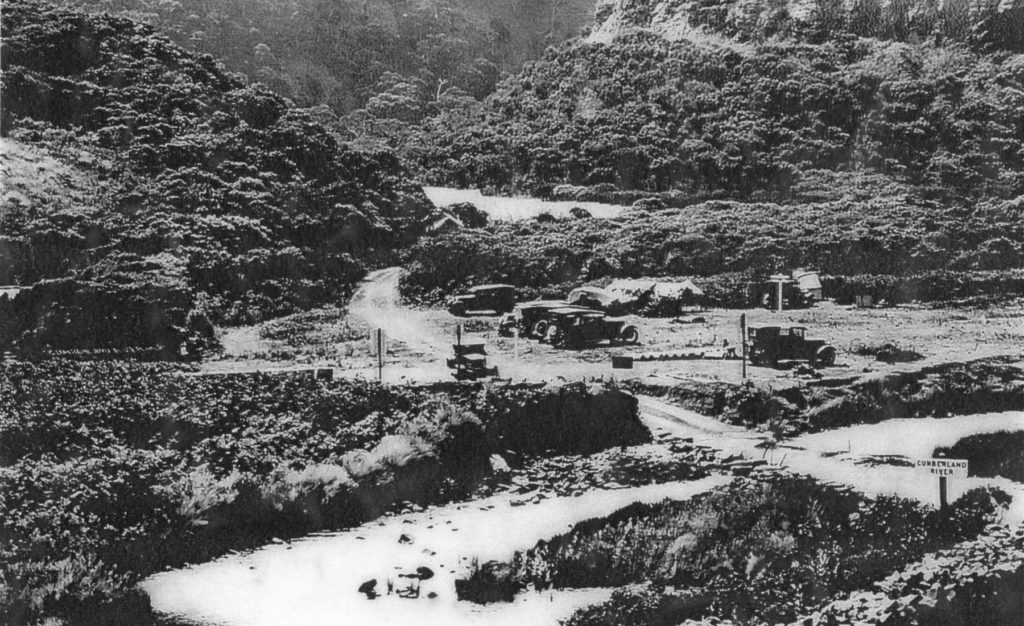 Cumberland River CRB camp with the river crossing and car parking early 1920's